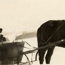 Horse drawn sleigh with 2 women in it; woman on left is Etta Ransom
