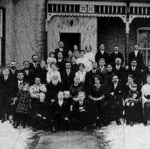 Preiss family in front of brick house, Clifford, ca.1900.
