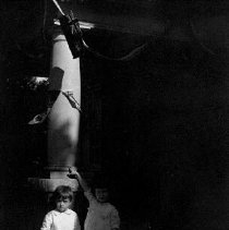 Two children by the British Union flag, photograph, ca. 1915.