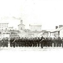 Uniformed military on Macdonnell Street, Guelph, Ontario, ca. 1866.
