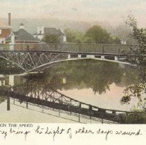 Footbridge on Speed River, Guelph, and houses on riverbank, ca. 1910.
