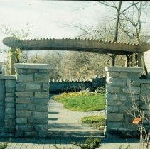ph 18240_11 Stone entrance gate, showing plaque and bower, Aug. 1986.