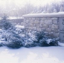 ph 18241_2 Stone wall, plaque, and shrubberies in winter, 9 Feb. 1989.
