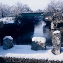 ph 18241_5 View over rock wall toward Tower St. Bridge over river, Apr. 198