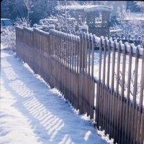 ph 18241_6 Wooden fence and trellis work in the snow, Apr. 1989.