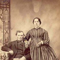 Seated man and standing woman identified as Uncle and Aunt Lee, ca. 1890.