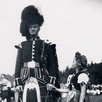 Drummer and dancer in highland costume, Fergus Highland Games ca. 1950