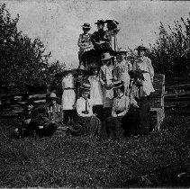 Women and children at barn raising, near Harriston, Minto Township, 1901.