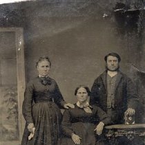 2 unidentified women and 1 man, ca.1865.