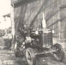 ph 19256 Laddie on tractor ca.1930
