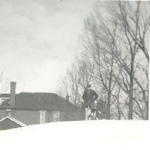ph 19109 man & dog on snow bank 1947