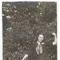 Unidentified girl holding baseball and bat, ca.1945