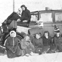 Young women gathered in front of car, Harriston[?], ca. 1945