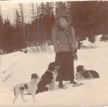 Win Orr on snowshoes, with dogs, ca. 1915.