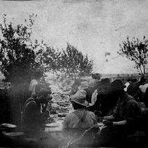 Meal time at barn raising, Harriston, Ontario, 1901.