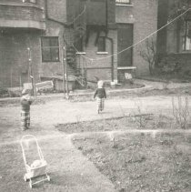 ph 16039: Child in baby carriage, [Grange]