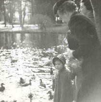 ph 16059: Woman, child, pond and ducks.