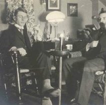 ph 16060: Two unidentified men, one with pipe.