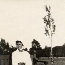 ph 16111: Woman, seated with croquet mallet [Kingsmill / Cruickston /