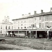 View towards City Hall, Guelph, showing signs for Kieran Bros., J. Massie.