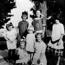 Children by tree at Clifford School, ca.1916.