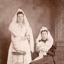 PH 23699 Two women, one seated holding tea cup, one holding teacup. ca.1895