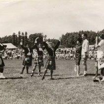 19715 young woman Scottish dancers, with bagpiper