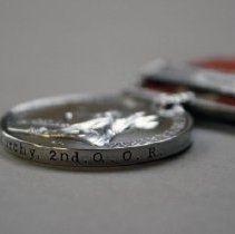 Detail of recipient's rank and unit.