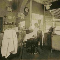 Lloyd Alexander in his barbershop in Knightville