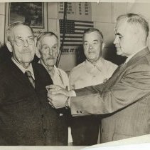 Howard Thompson getting 50 year badge from SPFD