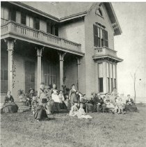 Scamman family in front of house