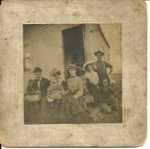 Family members in front of Madison Street home