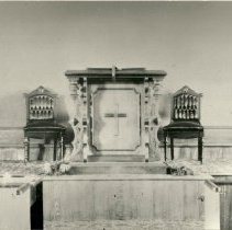 Red chairs and altar at Trinity Church