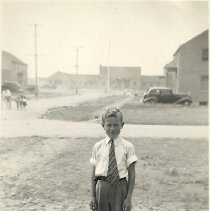 Redbank Village, young boy in foreground