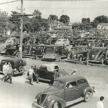 Parking lot and automobiles, New England shipyard