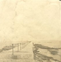 Breakwater with iron railing, to Bug Light