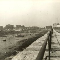 Breakwater with iron railing, looking toward Ferry Village