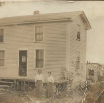 Two women in front of a house in Ferry Village