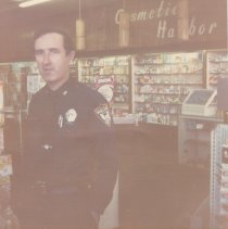 Officer Jim Taylor at Prescott's Pharmacy, 1976