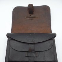 Under front flap of cartridge box