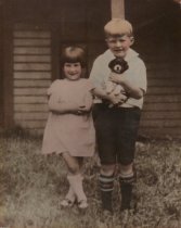 Two Children with a Puppy