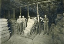 Men in a Grain Warehouse