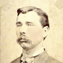 Young man with very long mustache
