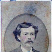 Young man wearing a green tie.