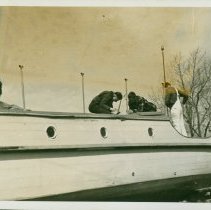 Sea Scouts doing repairs on a boat