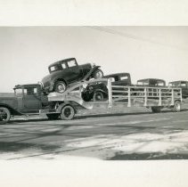 Dowmetal trailer loaded with cars