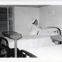 Nurse making a bed in Midland Hospital room