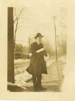 Image of Caucasian male with rolled papers, undated