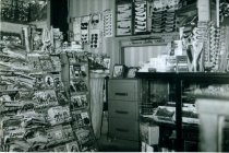Magazine rack, Inside the drugstore, dupilcate print ID L2016.06.28