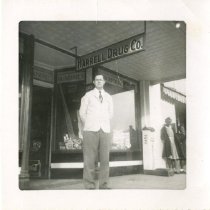 Martin Newby in front of the Harrell Drug Co.